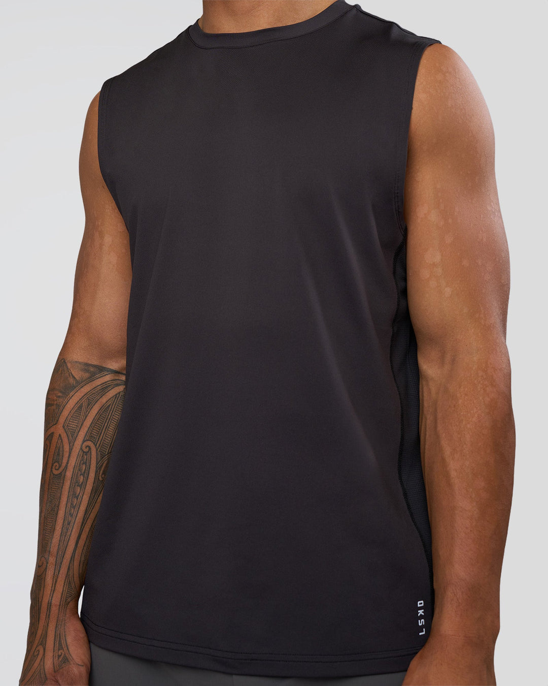 Man wearing AirTrack Muscle Tank - Black | Model:Daarian | Size:M