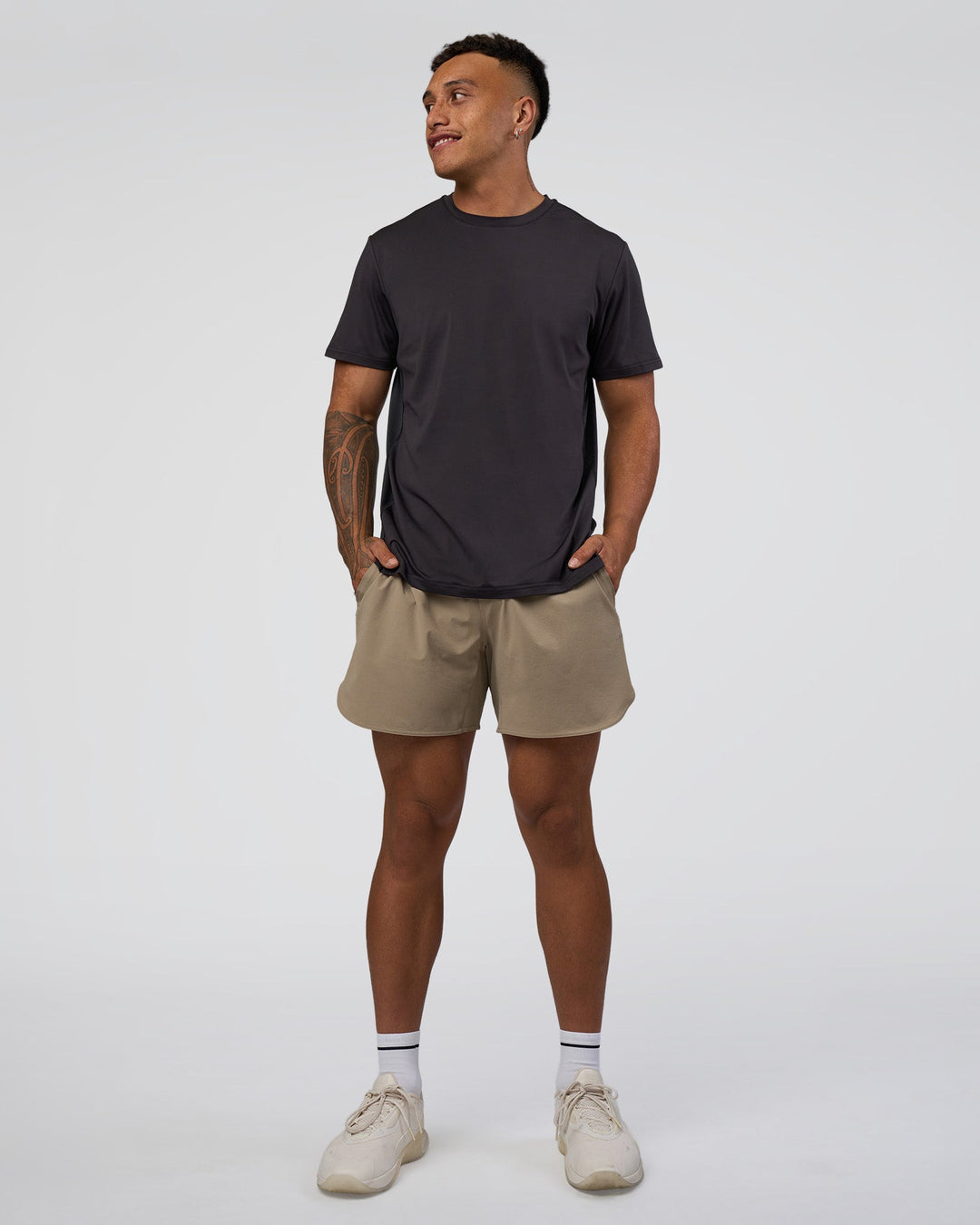 Man wearing AirTrack Tee - Black | Model:Daarian | Size:M