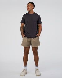 Man wearing AirTrack Tee - Black | Model:Daarian | Size:M