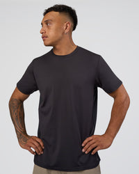 Man wearing AirTrack Tee - Black | Model:Daarian | Size:M