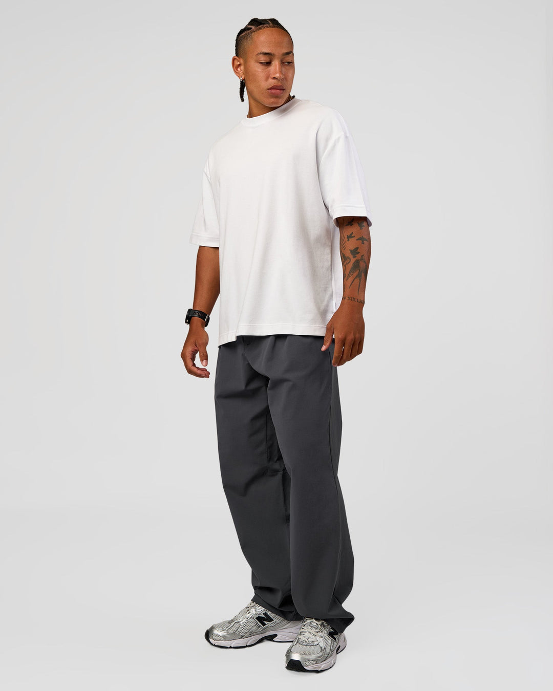 Man wearing All Day ZeroCrease™ Wide Leg Pant - Dark Storm | Model:Malebo | Size:M