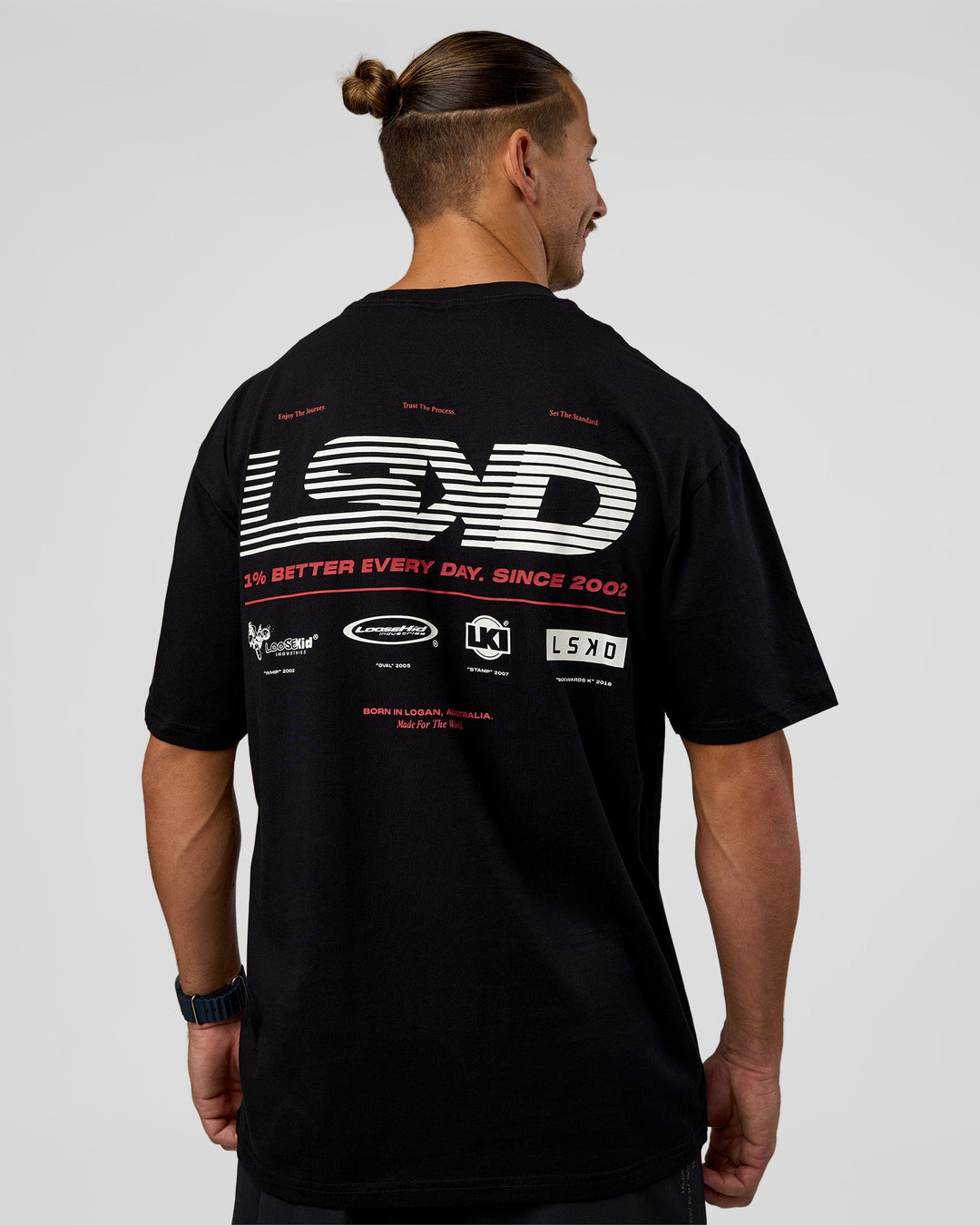 Man wearing Archive FLXCotton Oversized Tee - Black-Scarlet | Model:Jaiden | Size:M