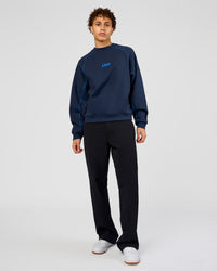 Man wearing Axis Boxy Crew Sweater - Future Navy-Palace Blue | Model:Leandro | Size:M