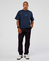 Man wearing Axis Heavyweight Oversized Boxed Tee - Future Navy-Palace Blue | Model:Malebo | Size:M