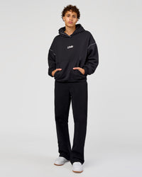 Man wearing Axis Oversized Hoodie - Caviar-White | Model:Leandro | Size:M