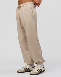 Man wearing Base Baggy Cuffed Track Pant - Shale Beige | Model:Albert | Size:M |