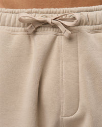 Man wearing Base Baggy Cuffed Track Pant - Shale Beige | Model:Albert | Size:M |