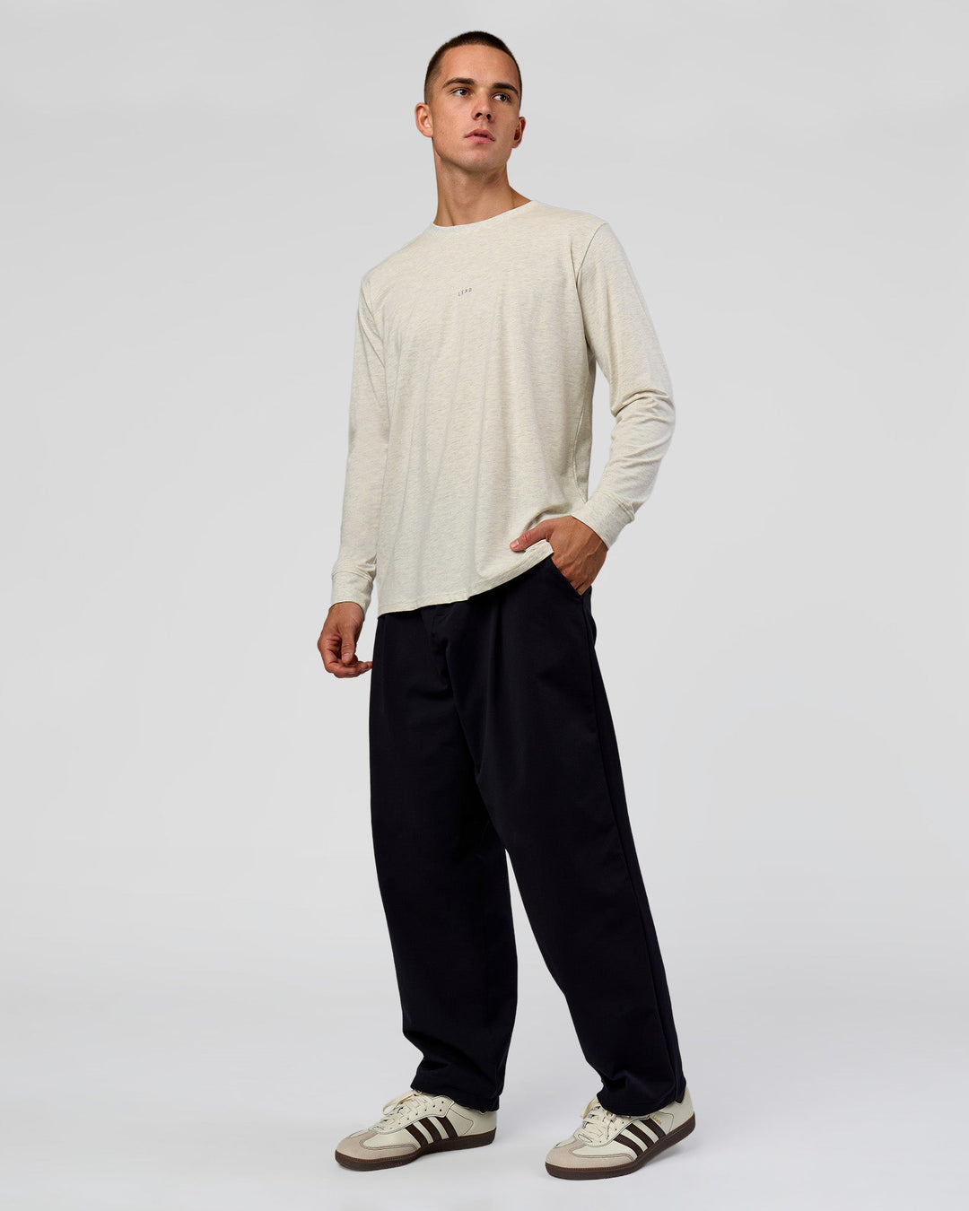 Man wearing Base FLXCotton Long Sleeve Tee in Silver Marl | Model:Albert | Size:M