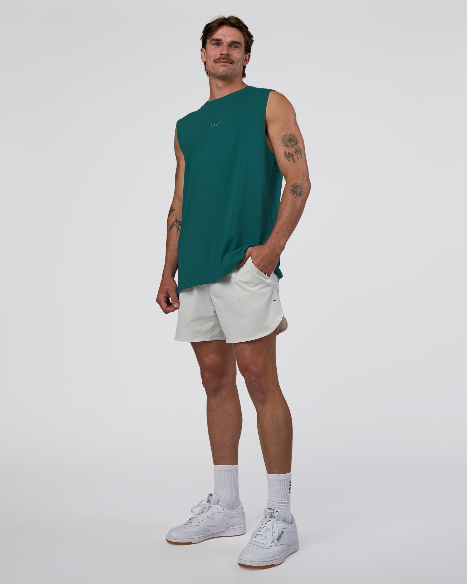 Man wearing Base FLXCotton Tank - Transformative Teal | Model:Konnor | Size:M