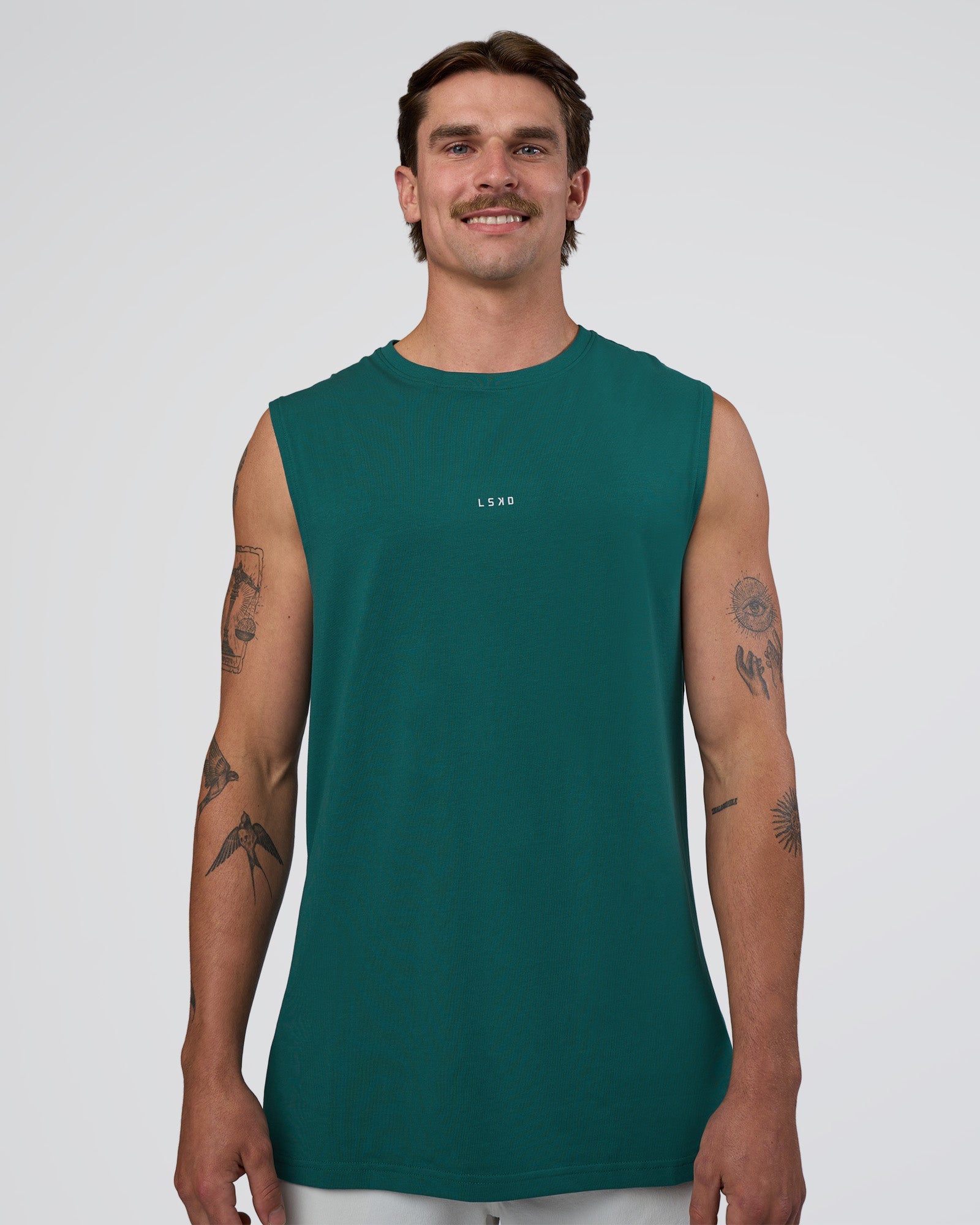 Man wearing Base FLXCotton Tank - Transformative Teal | Model:Konnor | Size:M