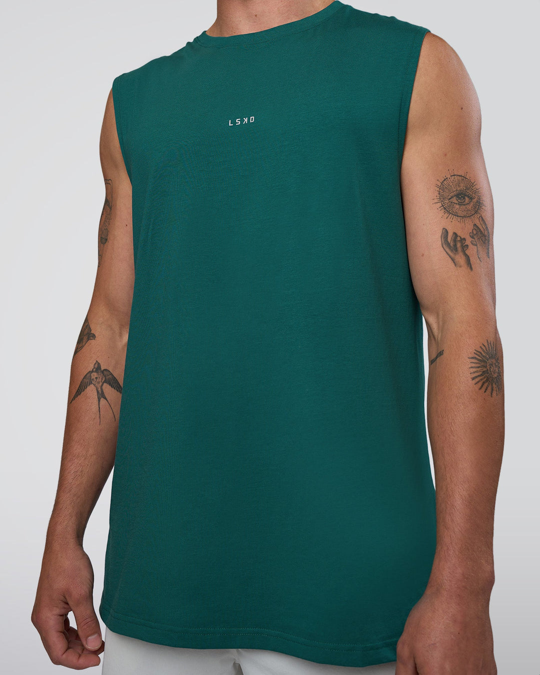 Man wearing Base FLXCotton Tank - Transformative Teal | Model:Konnor | Size:M
