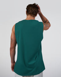Man wearing Base FLXCotton Tank - Transformative Teal | Model:Konnor | Size:M