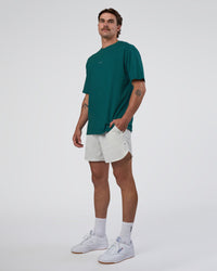 Man wearing Base FLXCotton Tee Oversized - Transformative Teal | Model:Konnor | Size:M
