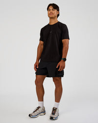 Man wearing Base FLXCotton Tee Regular Fit -8cm - Black | Model:George | Size:M