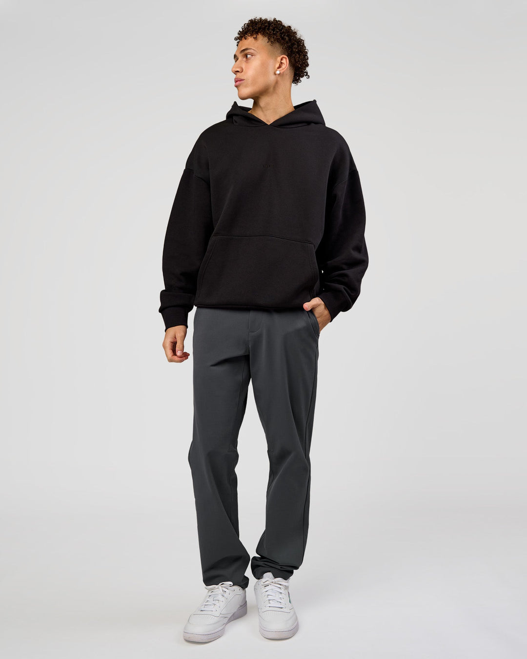 Man wearing Base Oversized Hoodie - Black | Model:Leandro | Size:M |