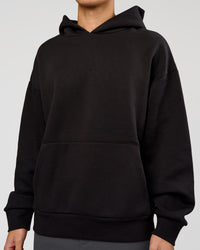 Man wearing Base Oversized Hoodie - Black | Model:Leandro | Size:M |