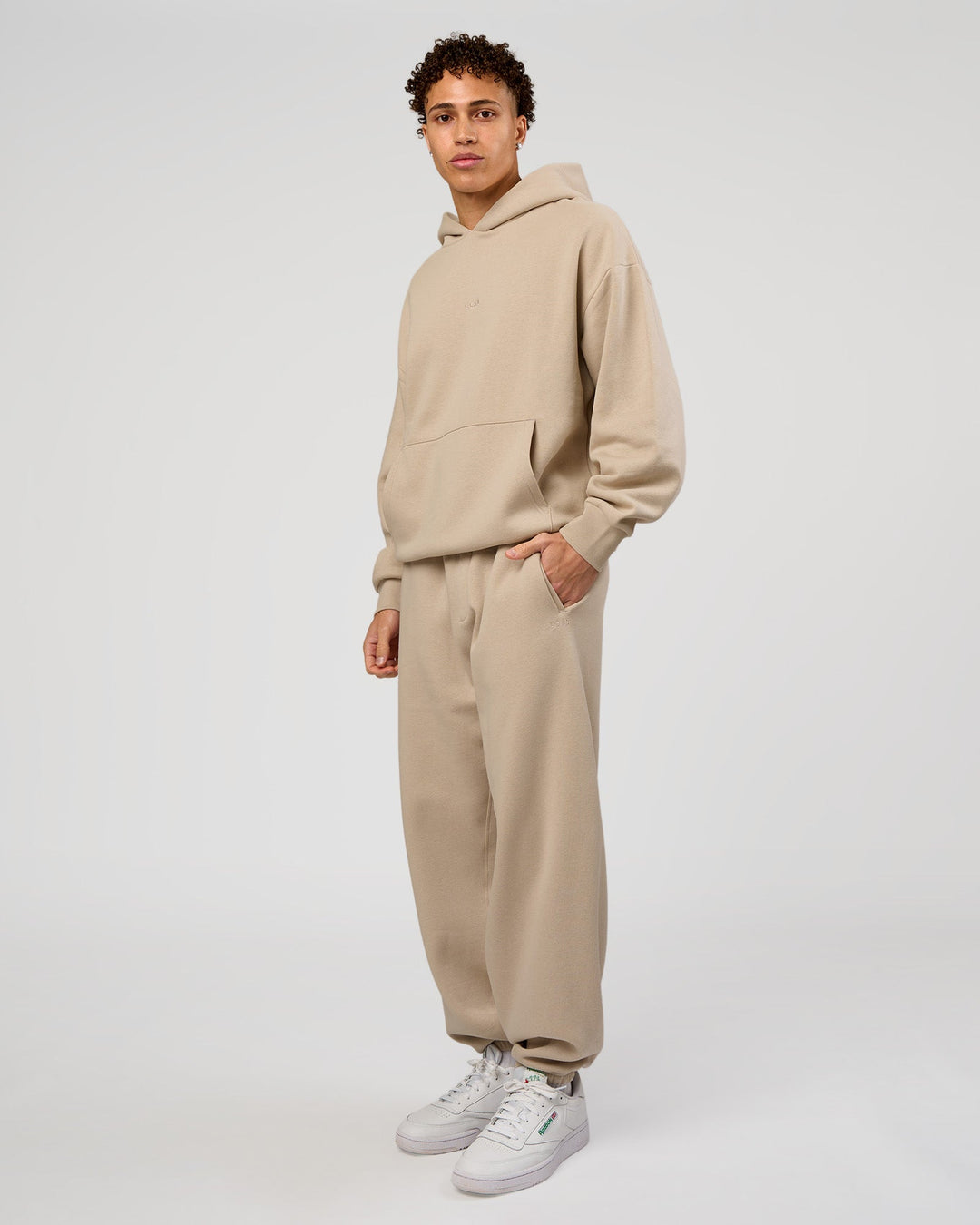 Man wearing Base Oversized Hoodie - Shale Beige | Model:Leandro | Size:M |