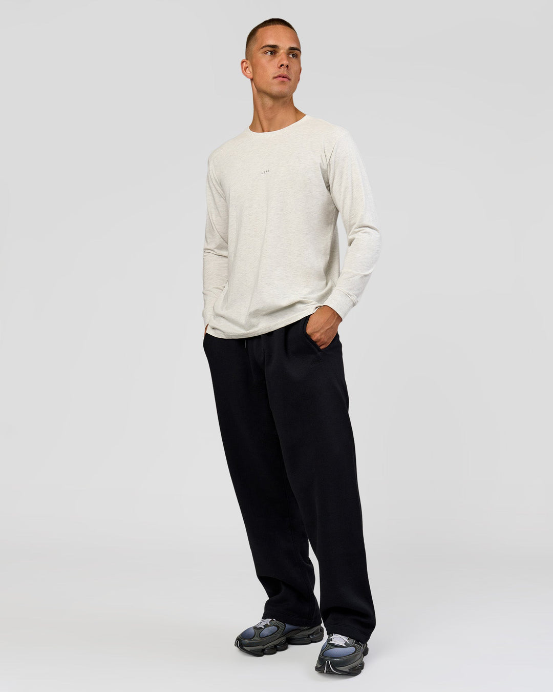 Man wearing Base Wide Leg Track Pant - Black | Model:Albert | Size:M |
