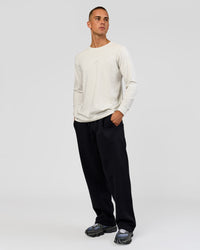Man wearing Base Wide Leg Track Pant - Black | Model:Albert | Size:M |

