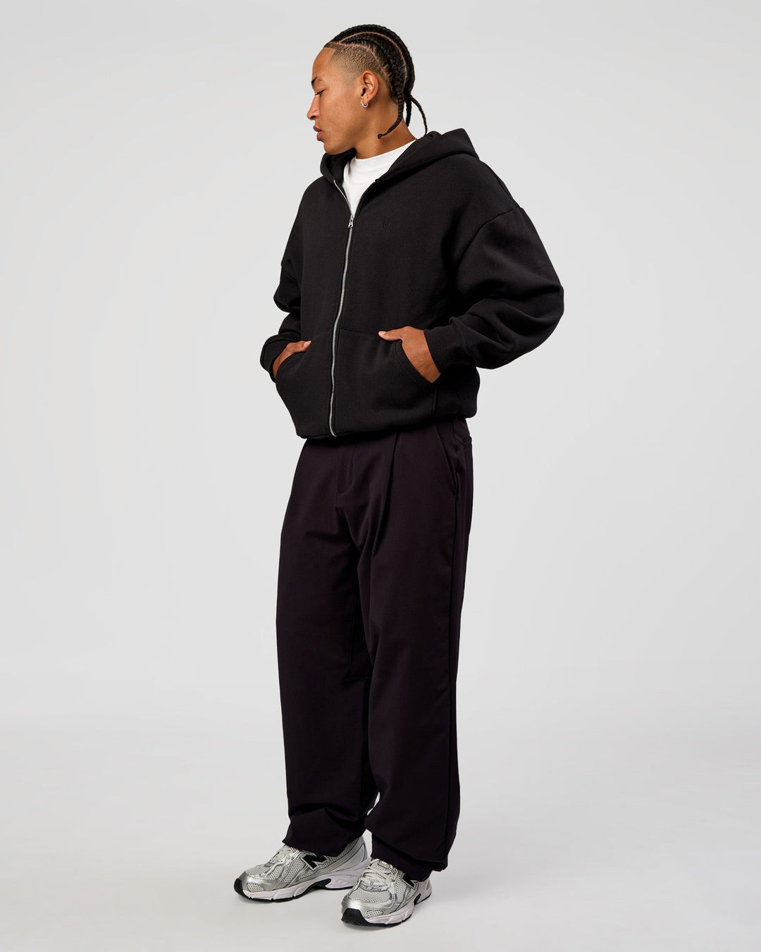 Man wearing Base Zip Through Oversized Hoodie - Black | Model:Malebo | Size:M