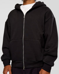 Man wearing Base Zip Through Oversized Hoodie - Black | Model:Malebo | Size:M