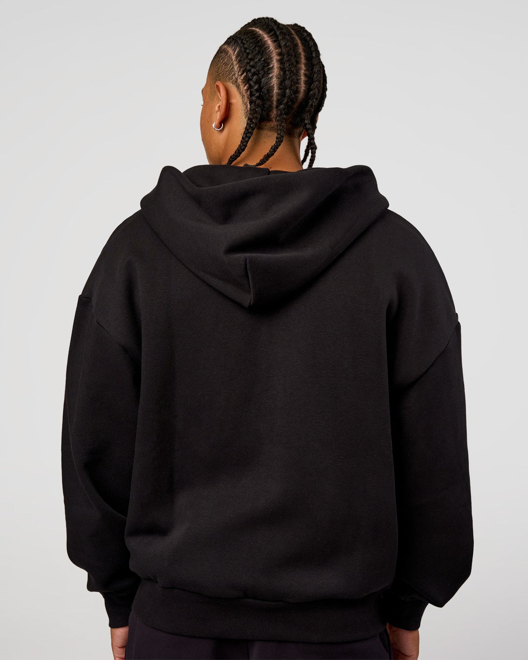 Man wearing Base Zip Through Oversized Hoodie - Black | Model:Malebo | Size:M