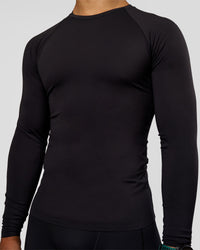 Man wearing BaseTech Long Sleeve Tee - Black | Model:George | Size:M