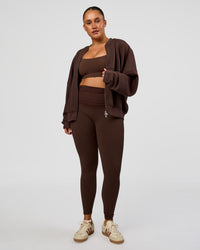 Woman wearing CF Elevate SoftTouch Bomber - Hot Chocolate | Model:Simmy | Size:M