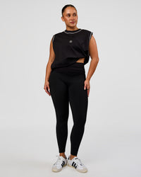 Model wearing CF Fold Over High-Rise Full Length Legging - Black | Model:Simmy | Size:M
