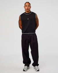 Man wearing CF Unisex Oversized Heavyweight Boxed Tank - Black-CF X LSKD Sport | Model:Malebo | Size:M