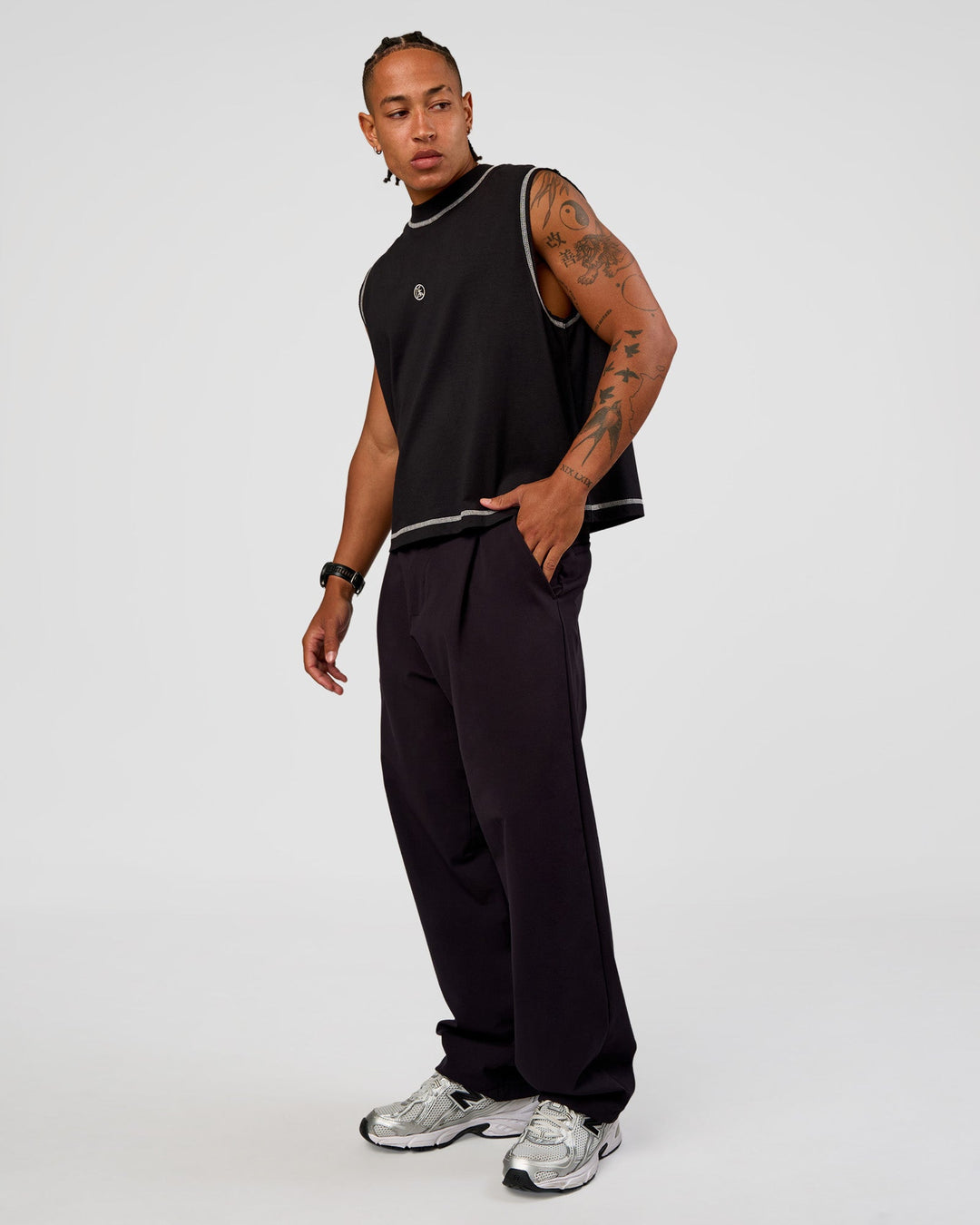 Man wearing CF Unisex Oversized Heavyweight Boxed Tank - Black-CF X LSKD Sport | Model:Malebo | Size:M