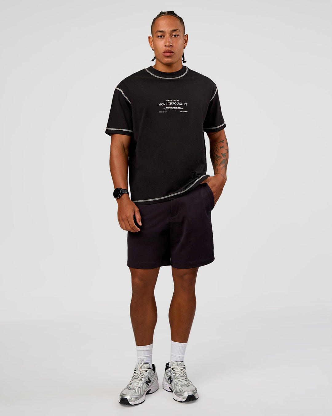 Man wearing CF Unisex Oversized Heavyweight FLXCotton Tee - Black-CF Move Through It | Model:Malebo | Size:M