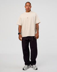 Man wearing CF Unisex Oversized Heavyweight FLXCotton Tee - Clay-CF X LSKD Sport | Model:Malebo | Size:M