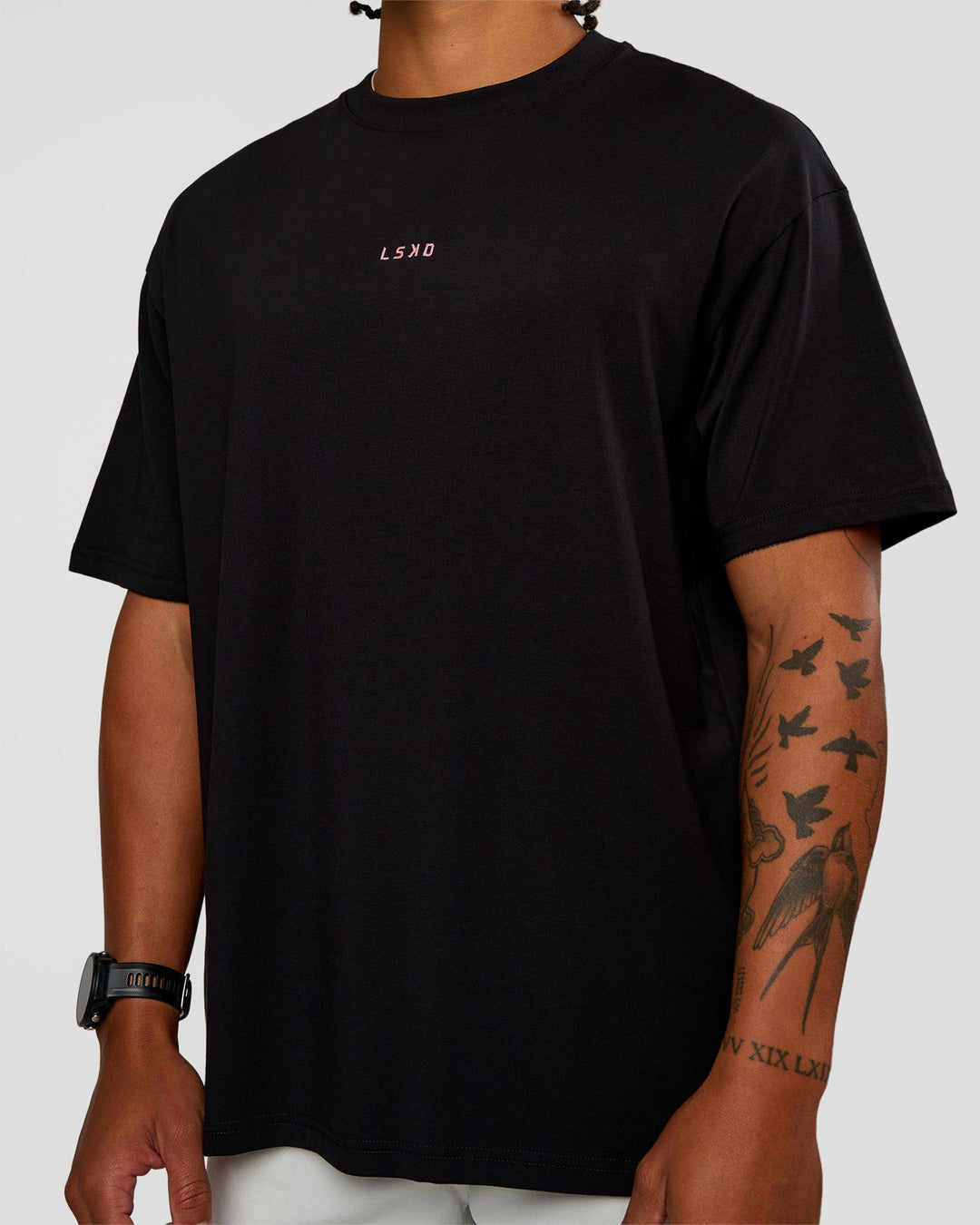 Man wearing CFT BNE 26 FLXCotton Oversized Tee in Black | Model:Malebo | Size:M