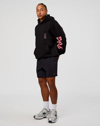 Man wearing CFT BNE 26 Unisex Oversized Hoodie - Black-Candy Pink | Model:Malebo | Size:M