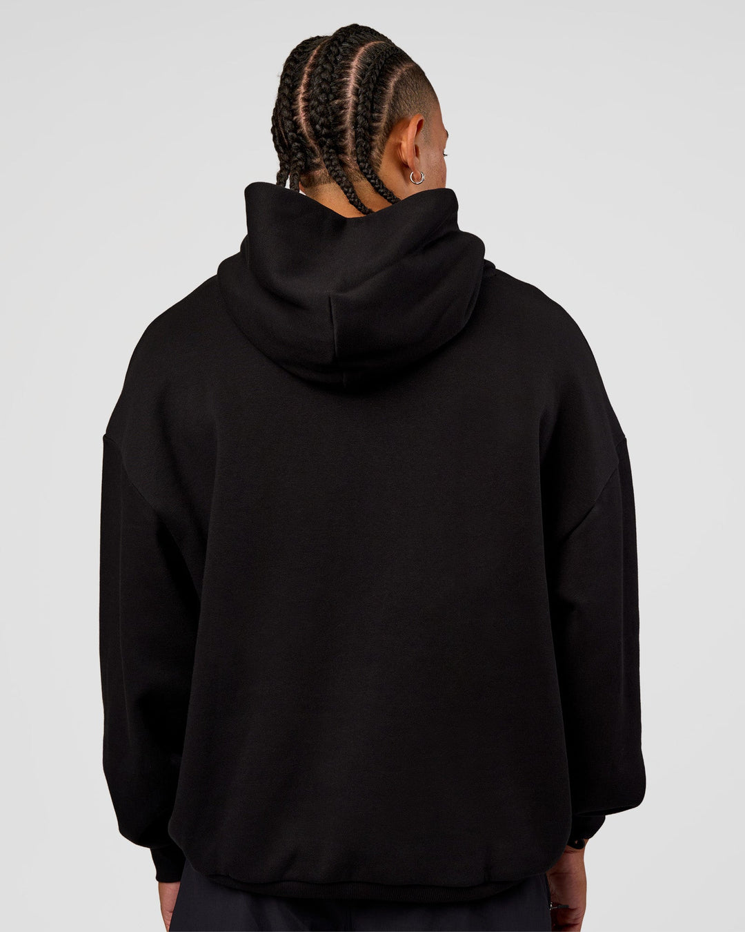 Man wearing CFT BNE 26 Unisex Oversized Hoodie - Black-Candy Pink | Model:Malebo | Size:M