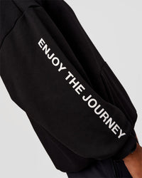 Man wearing CFT BNE 26 Unisex Oversized Hoodie - Black-Candy Pink | Model:Malebo | Size:M