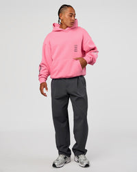 Man wearing CFT BNE 26 Unisex Oversized Hoodie - Candy Pink-Black | Model:Malebo | Size:M