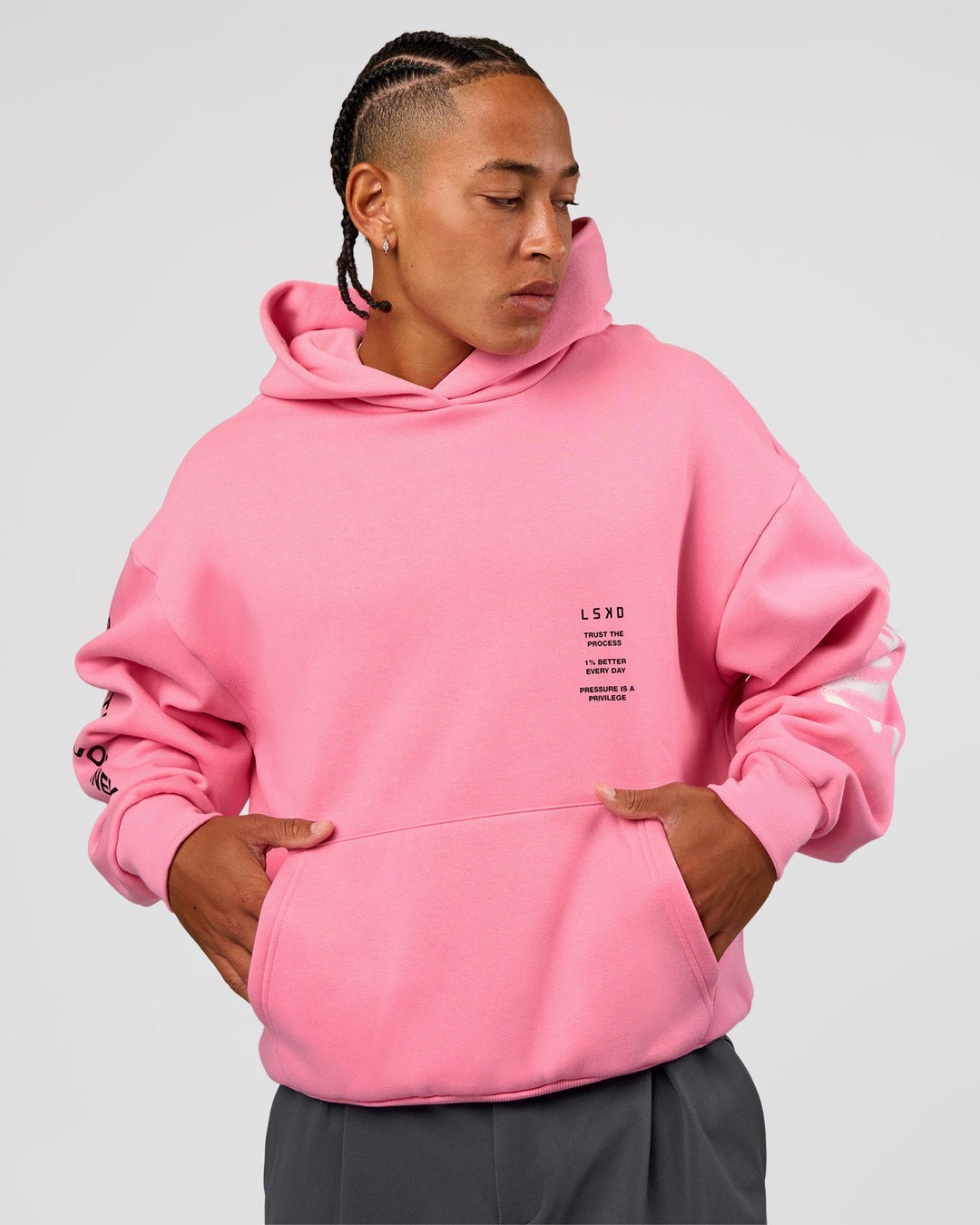Man wearing CFT BNE 26 Unisex Oversized Hoodie - Candy Pink-Black | Model:Malebo | Size:M