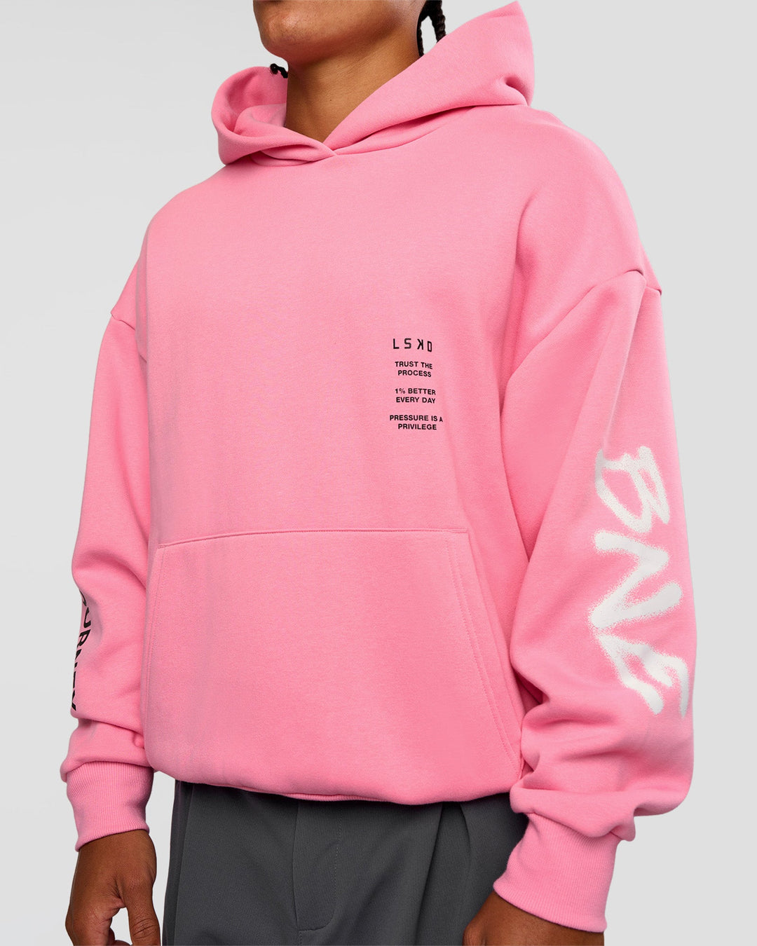 Man wearing CFT BNE 26 Unisex Oversized Hoodie - Candy Pink-Black | Model:Malebo | Size:M