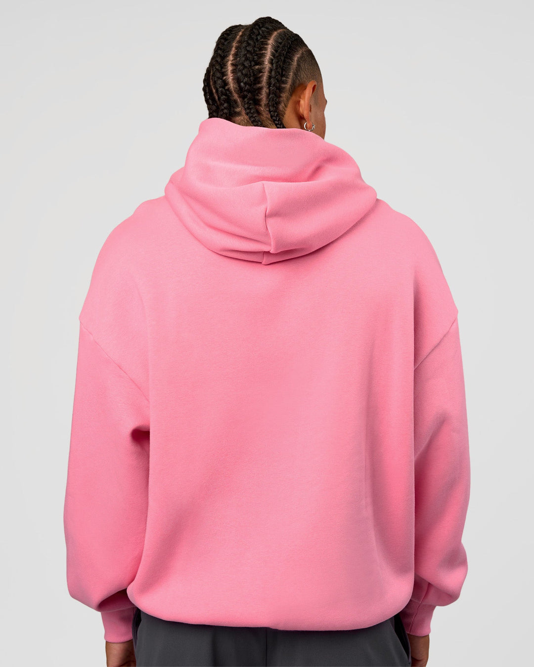 Man wearing CFT BNE 26 Unisex Oversized Hoodie - Candy Pink-Black | Model:Malebo | Size:M