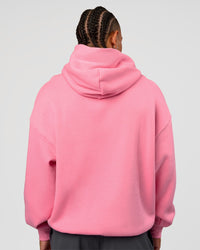 Man wearing CFT BNE 26 Unisex Oversized Hoodie - Candy Pink-Black | Model:Malebo | Size:M