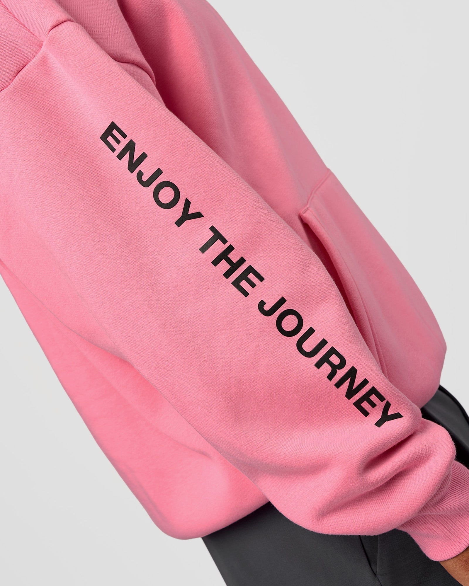 Man wearing CFT BNE 26 Unisex Oversized Hoodie - Candy Pink-Black | Model:Malebo | Size:M