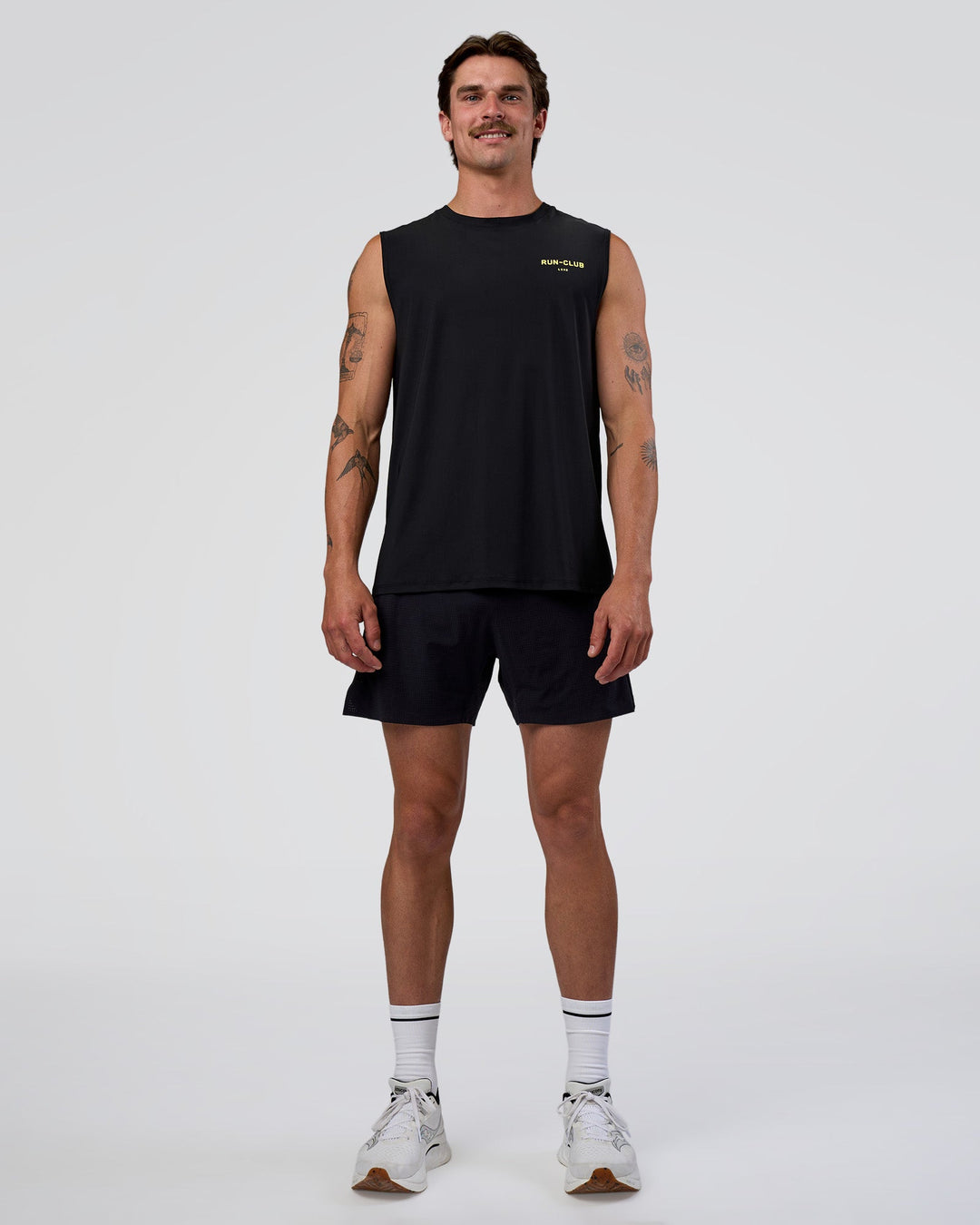 Man wearing Cadence RUN CLUB Muscle Tank - Black-Yellow Fizz | Model:Konnor | Size:M - view 6