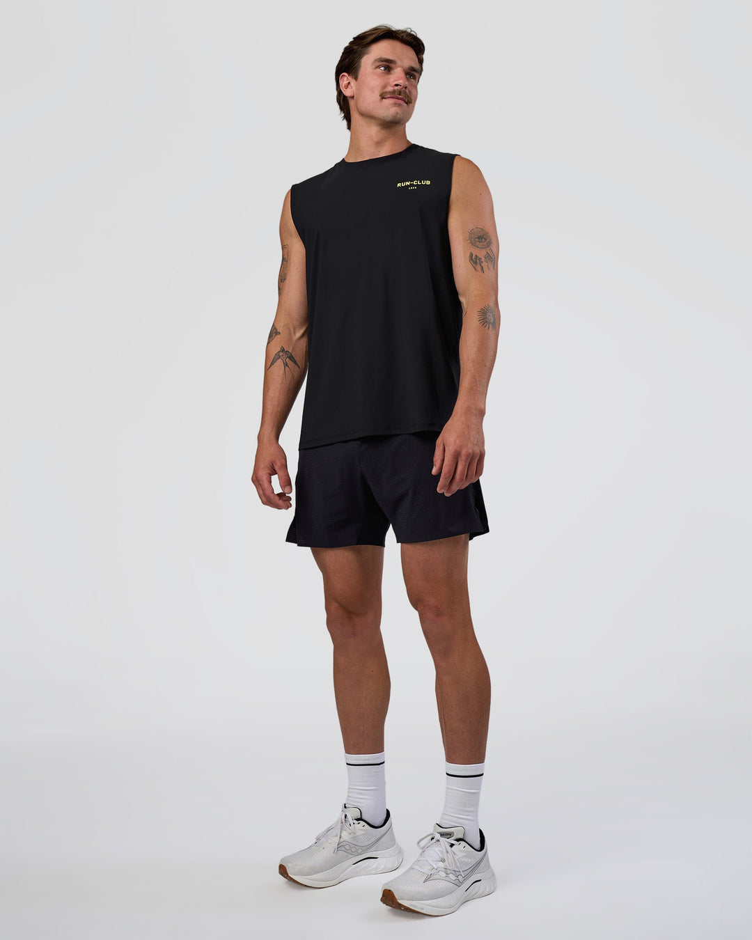 Man wearing Cadence RUN CLUB Muscle Tank - Black-Yellow Fizz | Model:Konnor | Size:M - view 4