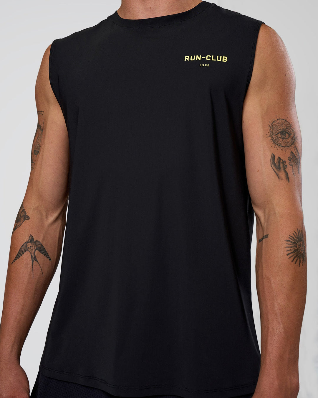 Man wearing Cadence RUN CLUB Muscle Tank - Black-Yellow Fizz | Model:Konnor | Size:M - view 7