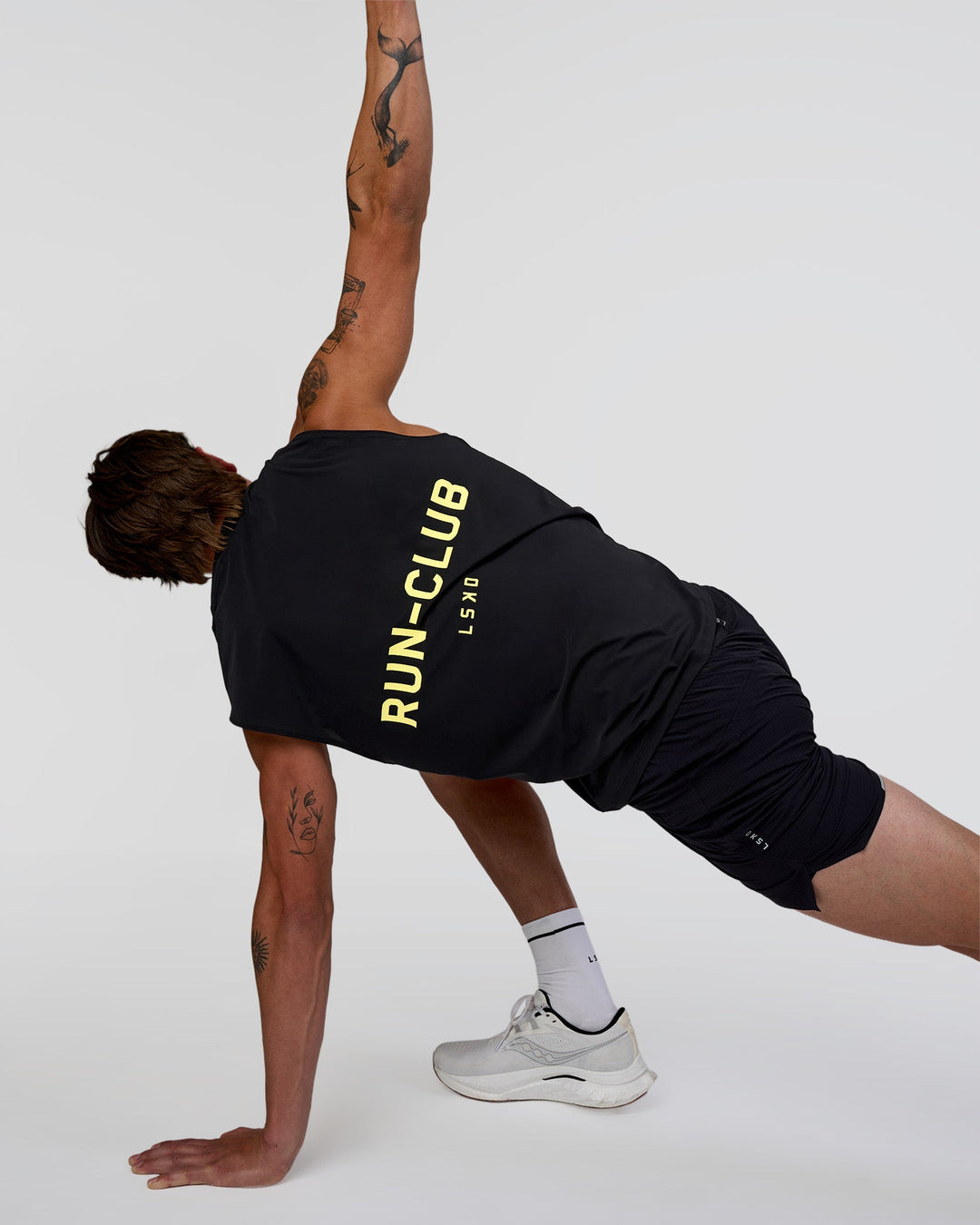 Man wearing Cadence RUN CLUB Muscle Tank - Black-Yellow Fizz | Model:Konnor | Size:M - view 5