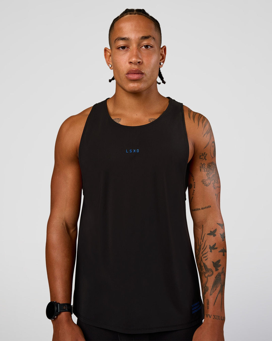 Man wearing Cadence Run Club Script Values Tank - Black-Palace Blue | Model:Malebo | Size:M