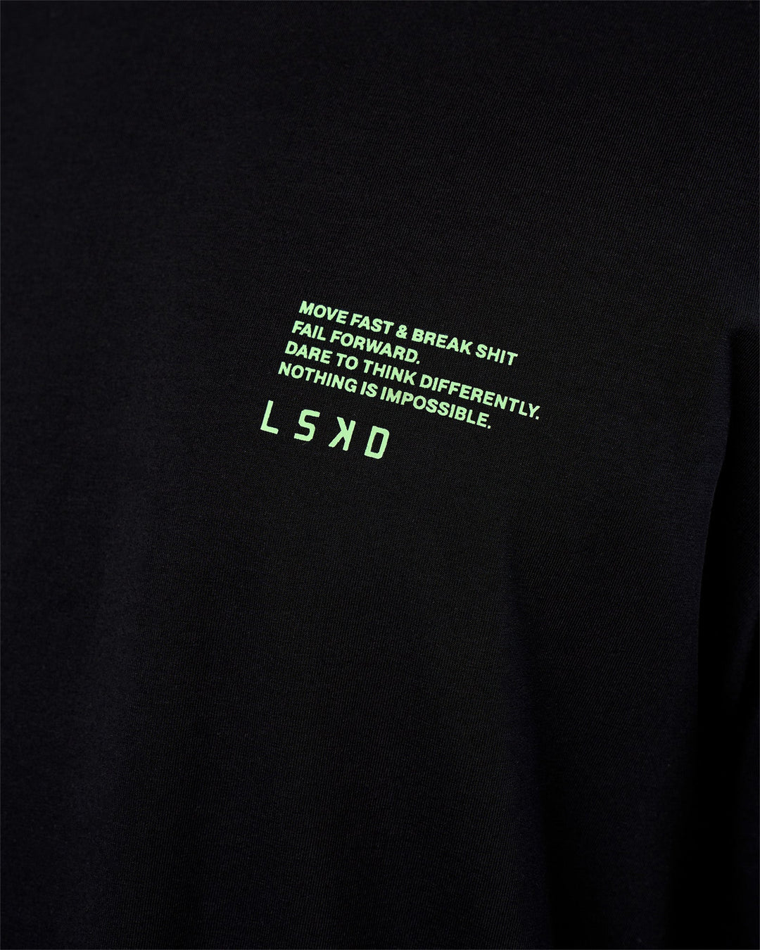 Man wearing Coffee Run FLXCotton Oversized Tee - Black-Solar Lime | Model:Zoran | Size:M