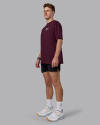 Man wearing Coffee Run FLXCotton Oversized Tee - Cherry Lacquer-Black | Model:Cameron | Size:M